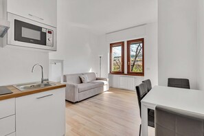 Appartement, 1 kingsize bed met slaapbank, niet-roken | Woonruimte | Flatscreentelevisie