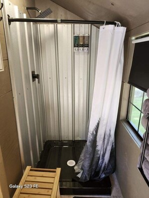 Shower, hair dryer, towels, soap