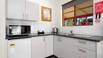 Fridge, microwave, toaster, cookware/dishes/utensils