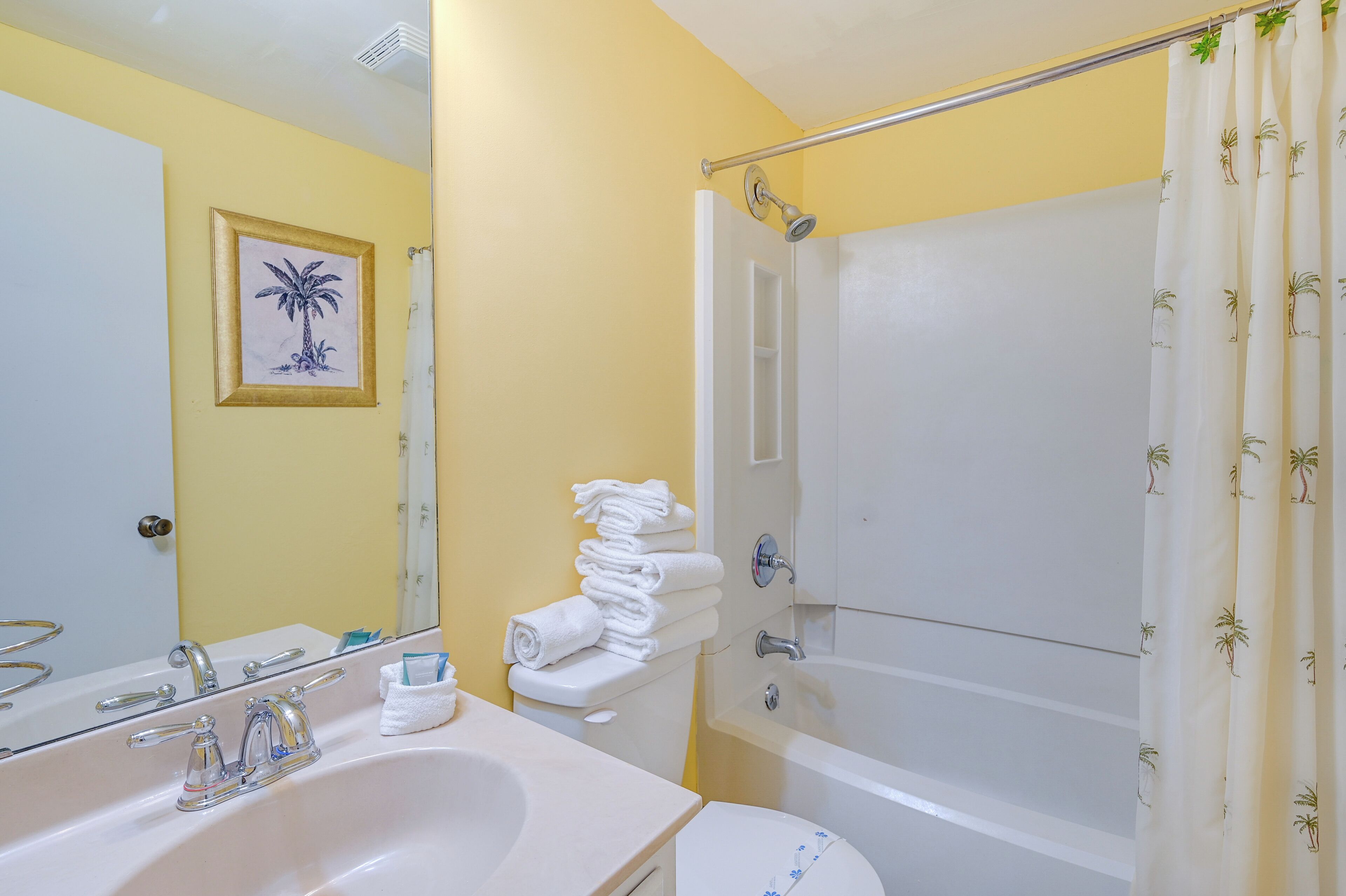 A bathroom with a bathtub, a sink, and a toilet.
