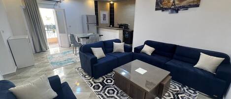 Comfort Apartment, Balcony, City View | Living area | Flat-screen TV