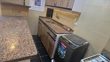 Departamento Confort, balcón, vista a la ciudad | Cocina privada