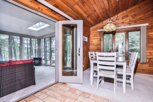 Scenic lakeside home on Three Lakes Chain with enclosed porch, dock, fire pit!