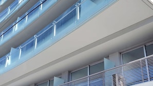 A modern hotel with multiple balconies, large windows, and a clean, contemporary design. - Green Bliss Spacious Studio in Nu ez (Buenos Aires)