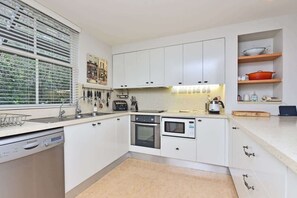 Coffee/tea maker, fridge, microwave, oven