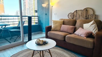 Superior Quadruple Room, 1 Double Bed with Sofa bed, Balcony, City View | Living area | 43-inch Smart TV with digital channels