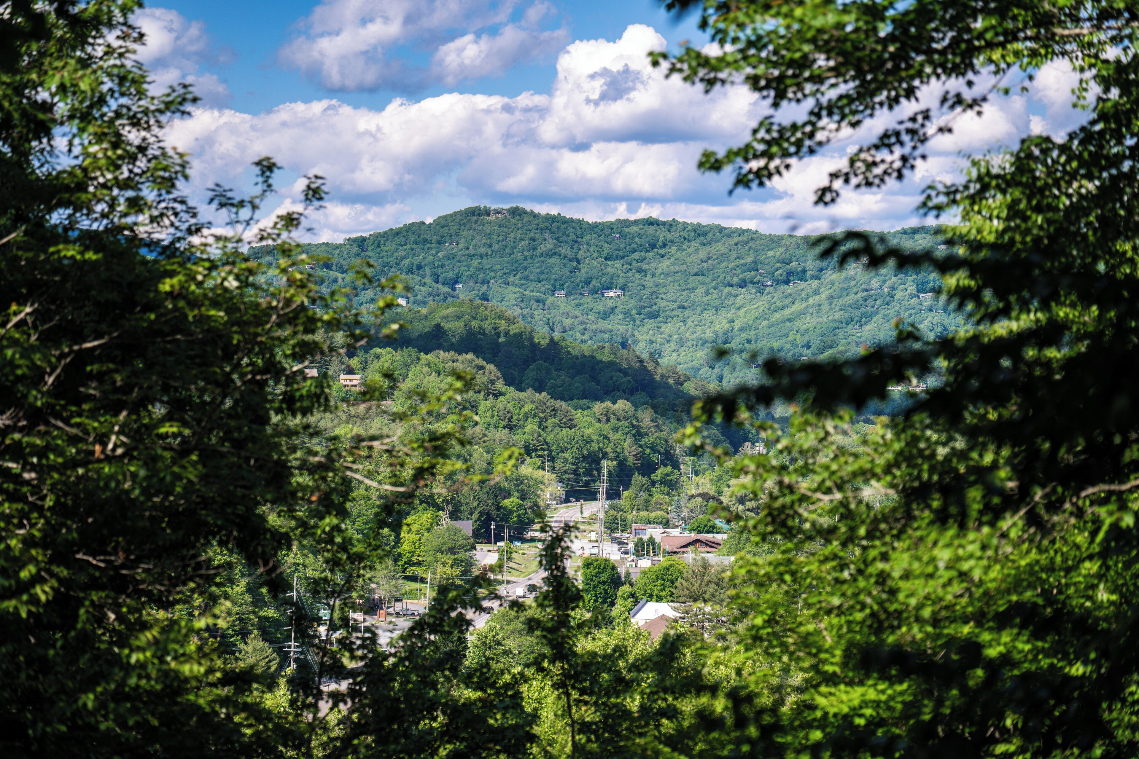 A mountainous landscape with a town nestled in the valley.