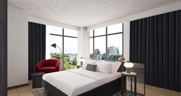 Ropa de cama de alta calidad y caja de seguridad en la habitación 