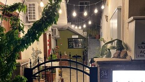 A gated entrance to a building with a sign reading 'Lokal Guest Houses.' - Lokal Ayvalık (Ayvalik)