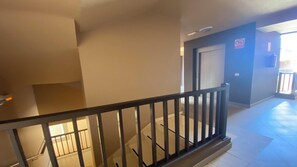 Corridors lead to inviting doors with a window on one side.