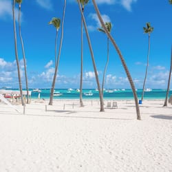 On the beach, white sand, beach umbrellas, beach towels