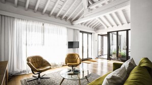 A spacious living room with a high ceiling, large windows, and a modern design. - Casa Porto with Sea View (Málaga)
