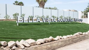 A sign for Belavista Marina Resort with a clear view of the resort's name.