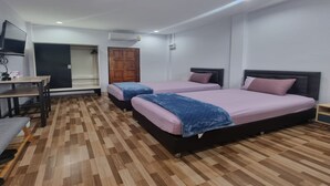 A bedroom with two beds, a desk, and a wardrobe. - Patamanan Residence Ang Thong (Wiset Chai Chan)