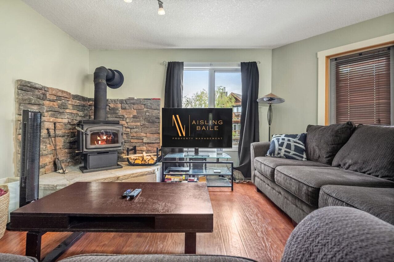 Living room with a wood-burning fireplace, cable TV, board games & cozy seating