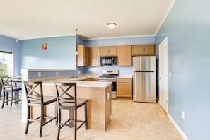 Enjoy casual dining or working at the central island with two bar stools.