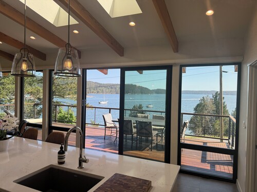 Summer Daze - enjoy in/outdoor living in this new ocean front designer home.