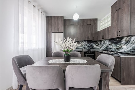Dining. City Escape Apartment by PikHost