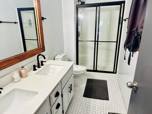 Shower, hair dryer, towels, soap