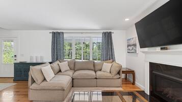Smart TV, fireplace, books, offices