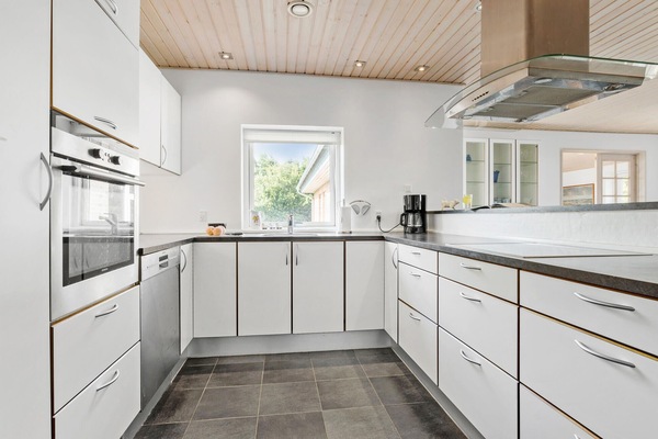 Fridge, stovetop, dishwasher, coffee/tea maker