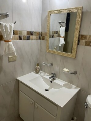 Shower, hair dryer, towels, soap