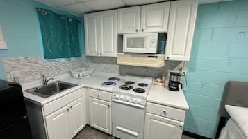 Mini-fridge, microwave, coffee/tea maker, cookware/dishes/utensils