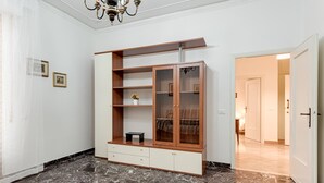 A room with a marble floor, a wooden cabinet with glass doors, and a chandelier. - Depandance Resort Apartment with Private Garden, Balcony, and Wi-Fi (Borgo San Lorenzo)