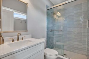 Shower, hair dryer, towels, shampoo