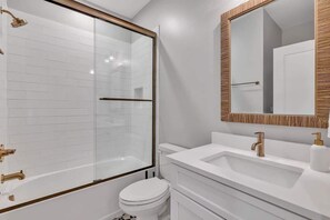 Shower, hair dryer, towels, shampoo