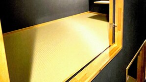 A room with a starry ceiling design, a framed picture on the wall, and a wooden-framed window. - Guest house cocode. - Hostel (Ishigaki)