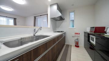 Full-size fridge, microwave, stovetop, electric kettle