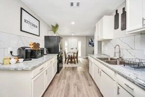 Fridge, microwave, oven, stovetop - 5BR 3BA Home with Hot Tub Near Stadiums & Airport (Houston)