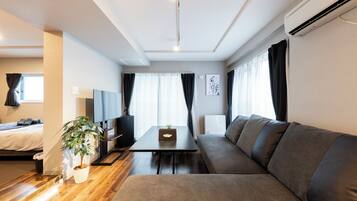 Basic Apartment | Living area | Flat-screen TV