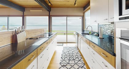 Waterfront family home with sandy beach and sunset views