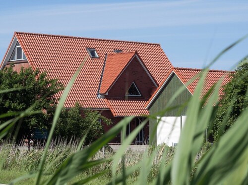 Apartment 'Ferienwohnung Austernfischer' with Shared Garden, Balcony and Wi-Fi