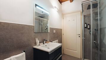 Hair dryer, slippers, towels, soap