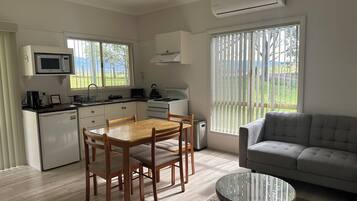 Darrawii Cottage | Private kitchen | Fridge, microwave, toaster, cookware/dishes/utensils