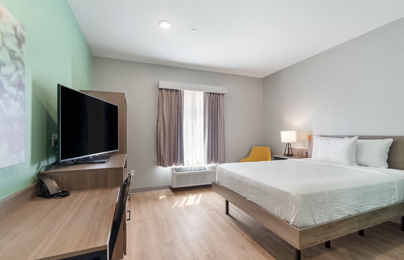 Desk, laptop workspace, blackout curtains, free WiFi