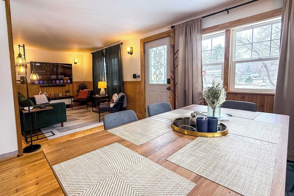 Dining room table, entryway and living room.