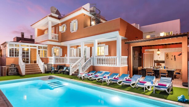 A large house with a swimming pool, a covered patio, and a staircase leading to a balcony. - Villa Naranja with private heated pool, sea views (Callao Salvaje)