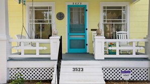 A house with a turquoise front door, white railings, and a number '3523' on the steps. - Welcome to "The Sunrise Inn!" (Galveston)