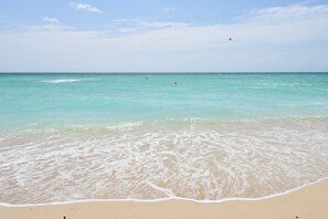 On the beach, sun-loungers, beach towels