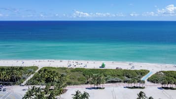 On the beach, sun loungers, beach towels
