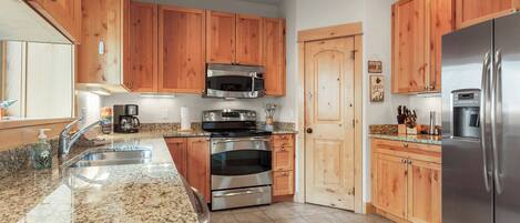 Microwave, stovetop, coffee/tea maker, cookware/dishes/utensils