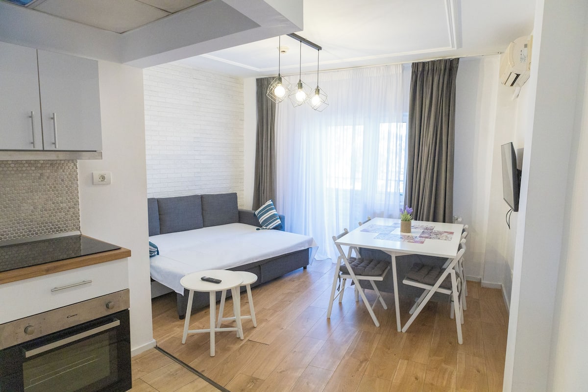 Comfort Apartment, Balcony | Living area | TV