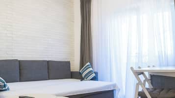 Comfort Apartment, Balcony | Living area | TV