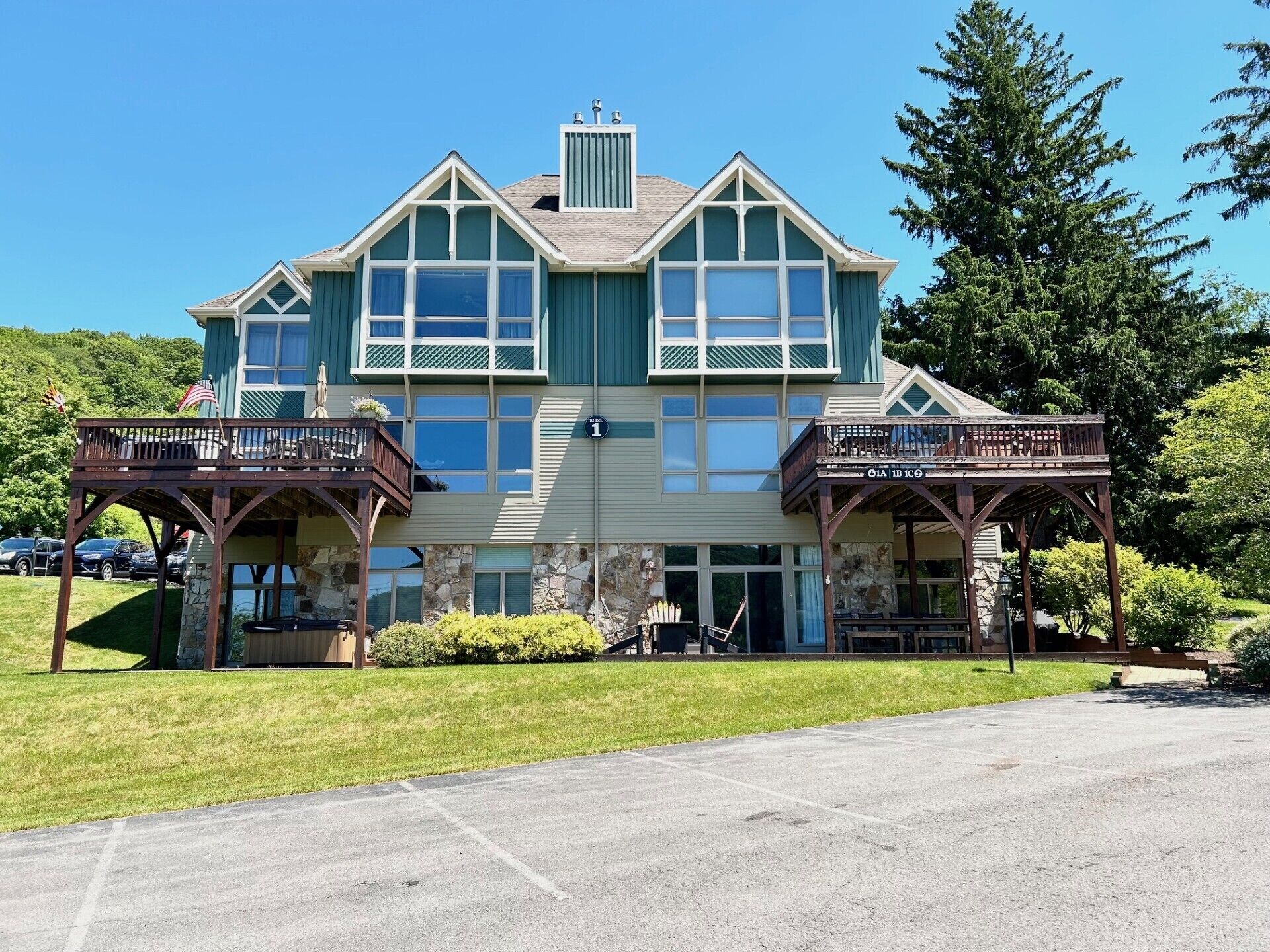 Center Stage | Serene Lake Views, Fireplace, Hot Tub + Great Location!