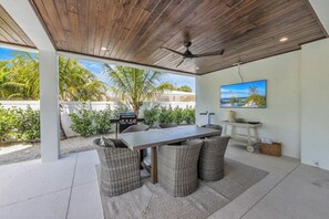 Outdoor dining - Brand New Luxury Home! Canal Front with Pool, Spa, and Rooftop Deck with Stunnin (Anna Maria)