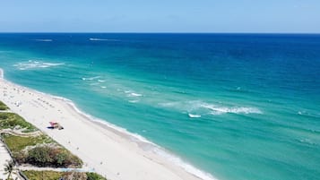 On the beach, sun loungers, beach towels